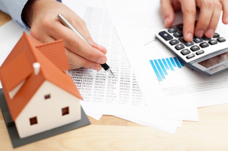 Closeup of man counting payments for home