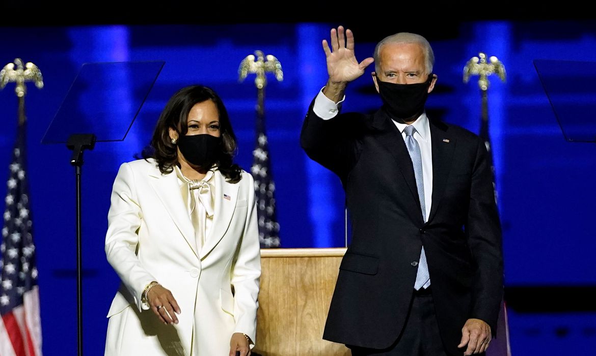 Democratic vice-presidential nominee Kamala Harris and Democratic 2020 U.S. presidential nominee Joe Biden greet supporters at an election rally, after news media announced that Biden has won the 2020 U.S. presidential election, in Wilmington, Delaware, U.S., November 7, 2020. Andrew Harnik/Pool via REUTERS