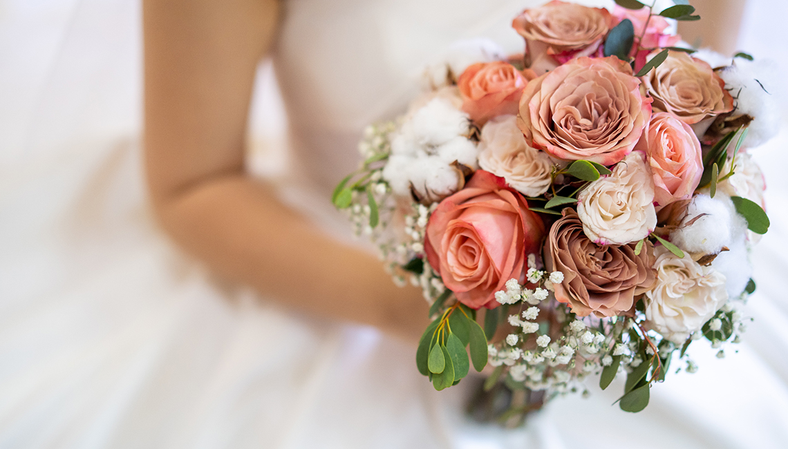 Asian bride with flower bouquet