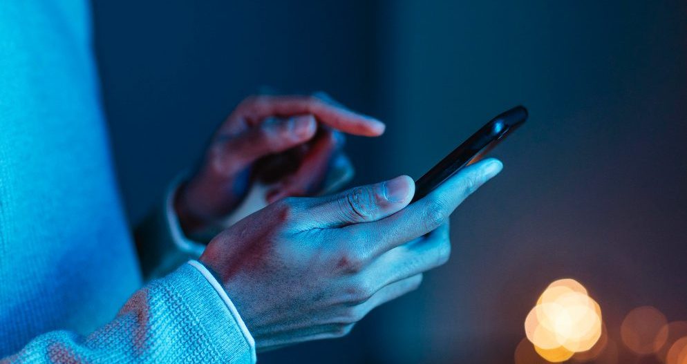 side-view-of-man-using-smartphone-1