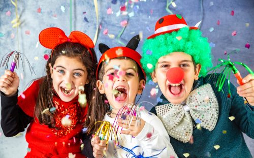 Three,Kids,Celebrating,Carnival,Together,At,Home