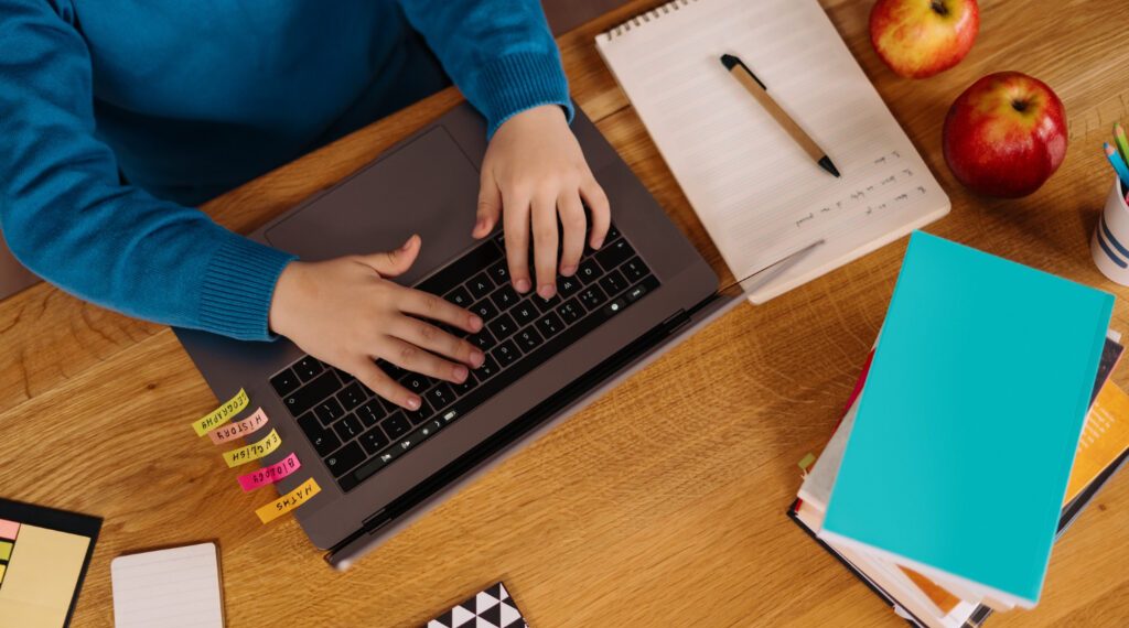 a-preteen-boy-uses-a-laptop-to-make-online-classes-1024x683-1